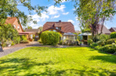 Gartenansicht - Gartenblicke statt Augenblicke: Einfamilienhaus mit grüner Oase und Wintergarten in Twist-Bült