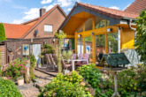 Terrasse - Gartenblicke statt Augenblicke: Einfamilienhaus mit grüner Oase und Wintergarten in Twist-Bült